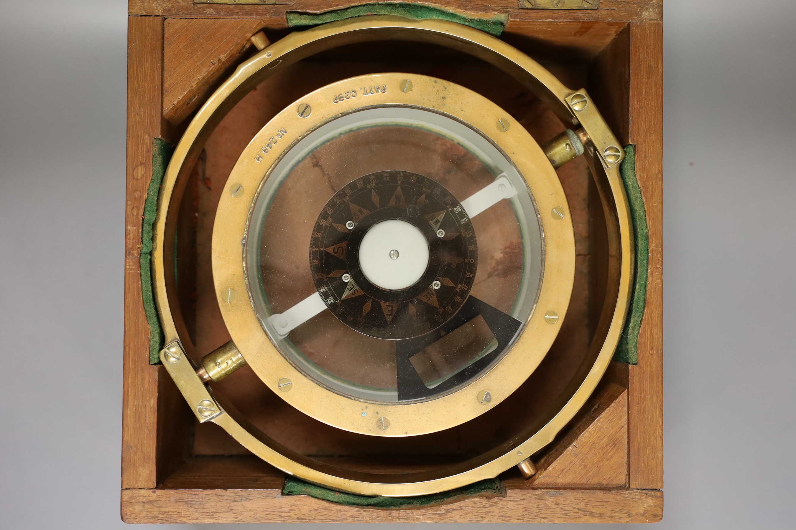 A wooden cased ship's compass, 14cm tall